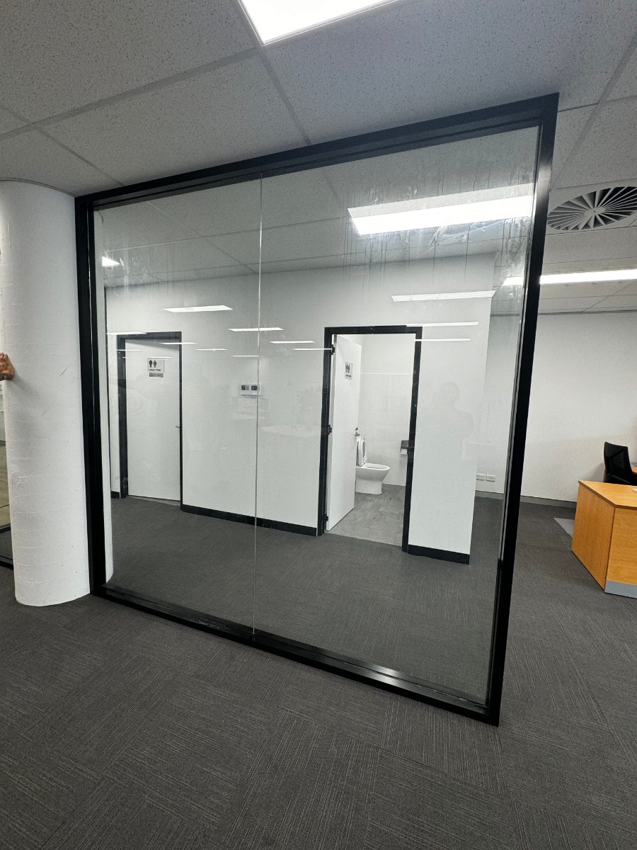 Framed glass partition wall replaced in an office near Murrumba Downs