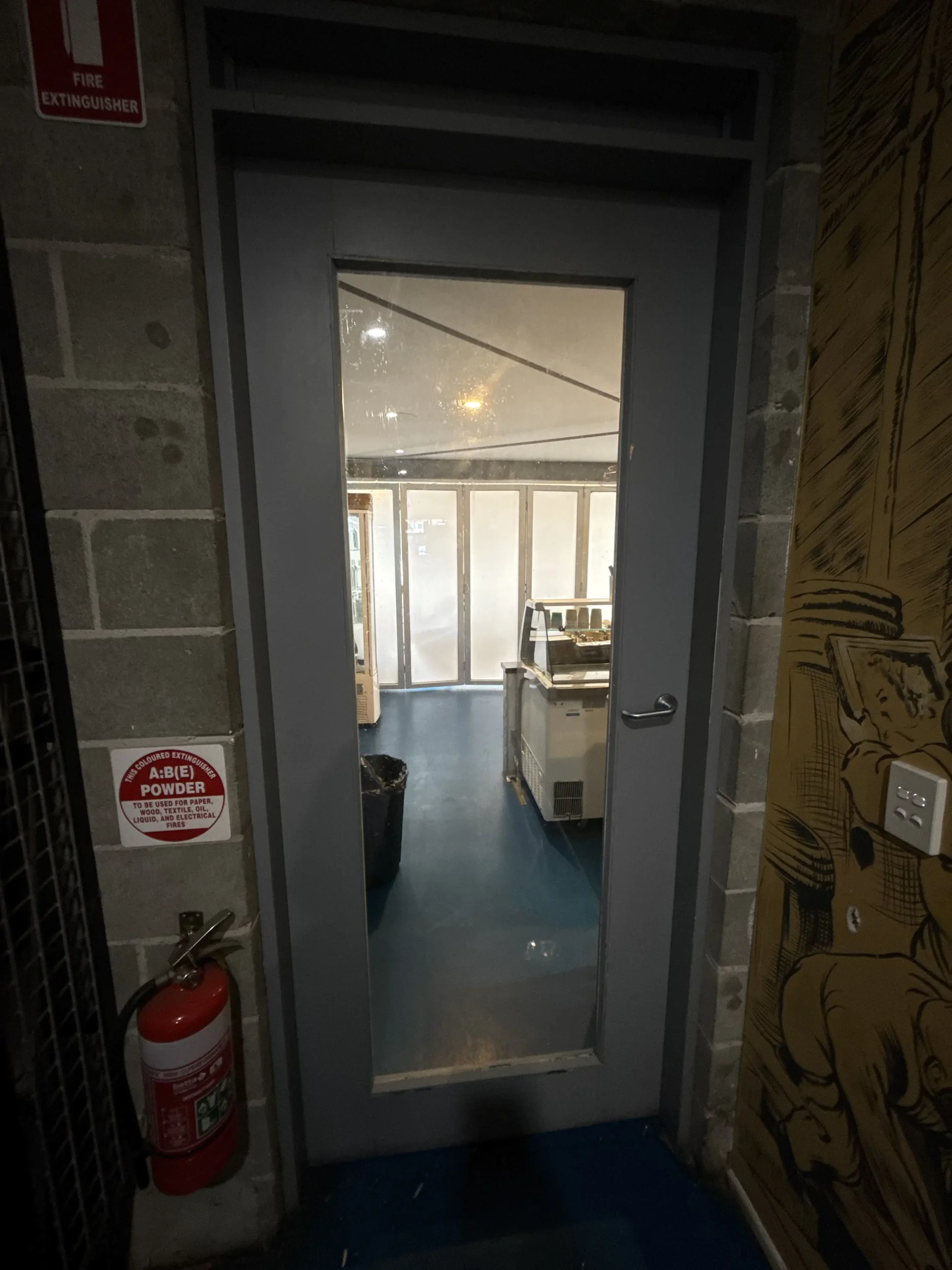 Glazier replacing broken door glass in Northgate